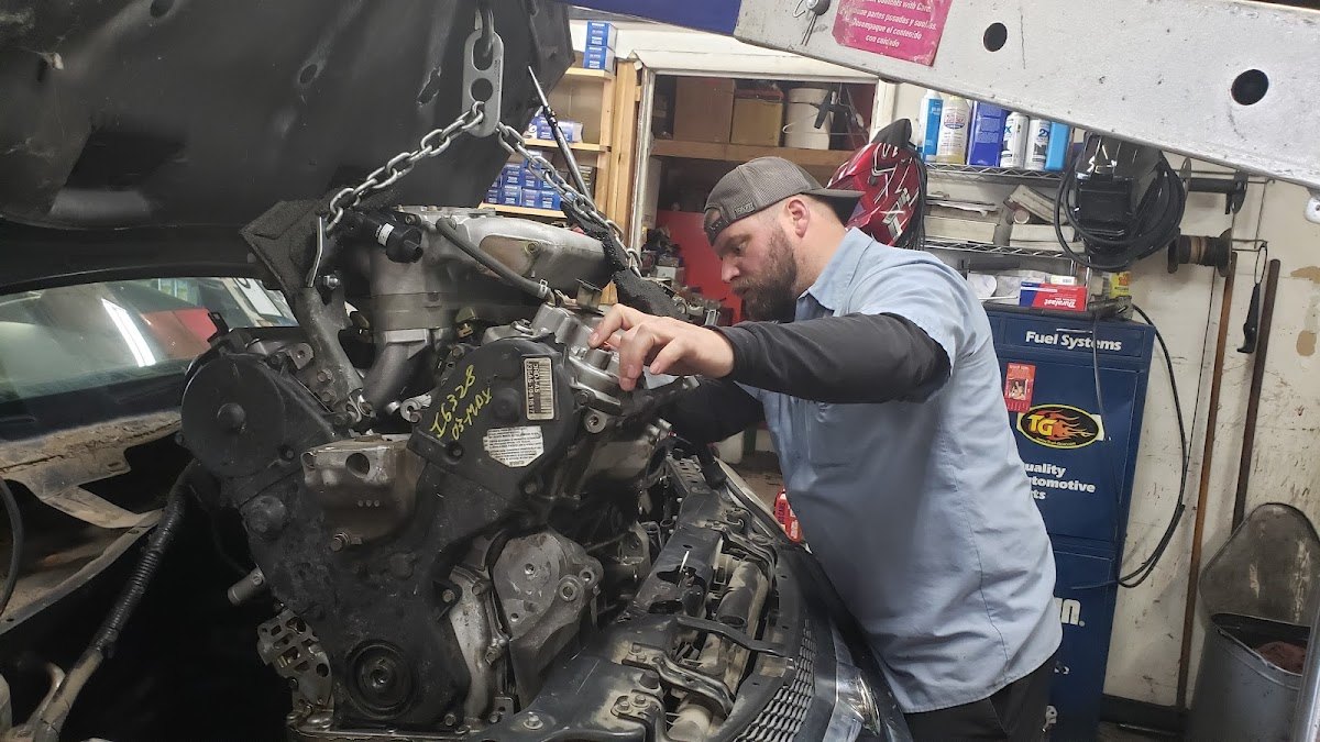 A Bench Garage mechanic working on an engine in Boise, ID